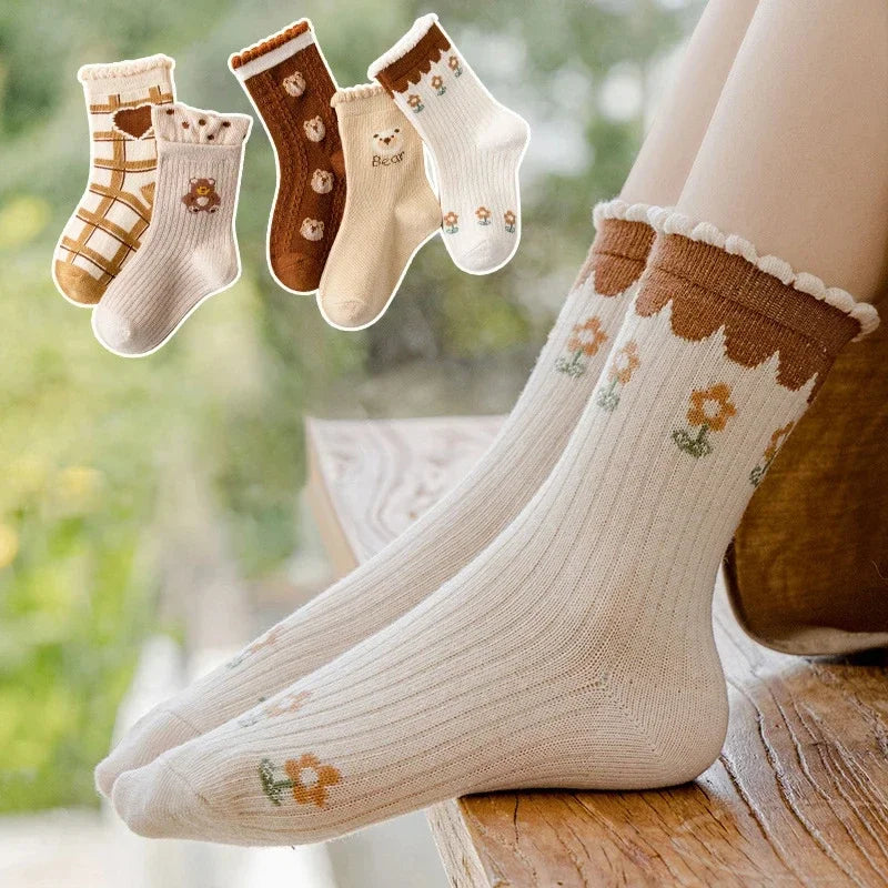 5 pairs of children's mid tube socks with spring and autumn love flower print for girls to keep warm. Children's mid tube socks